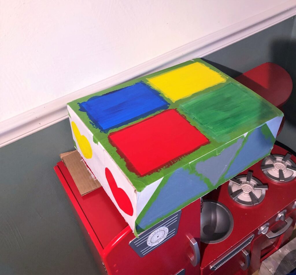 shape sorter painter's tape shapes DIY shape sorter