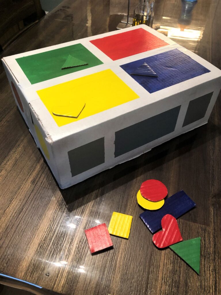 shape sorter and matching cutout shapes